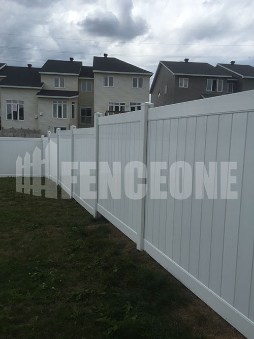 white vinyl fence surrounding backyard