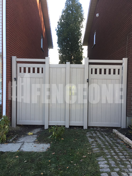 white vinyl fence with 2 gates