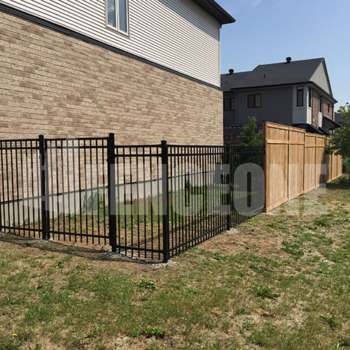 black iron fence and wooden fence