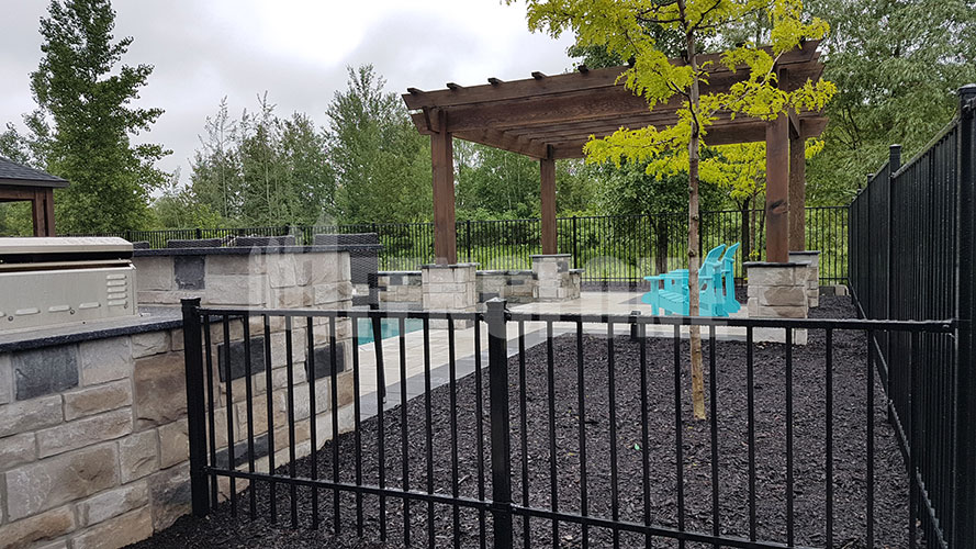 black fence surrounding pool with gate
