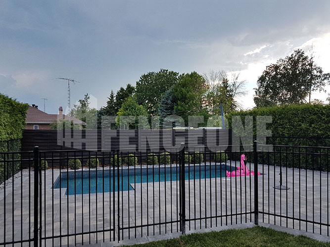 black iron fence surrounding pool